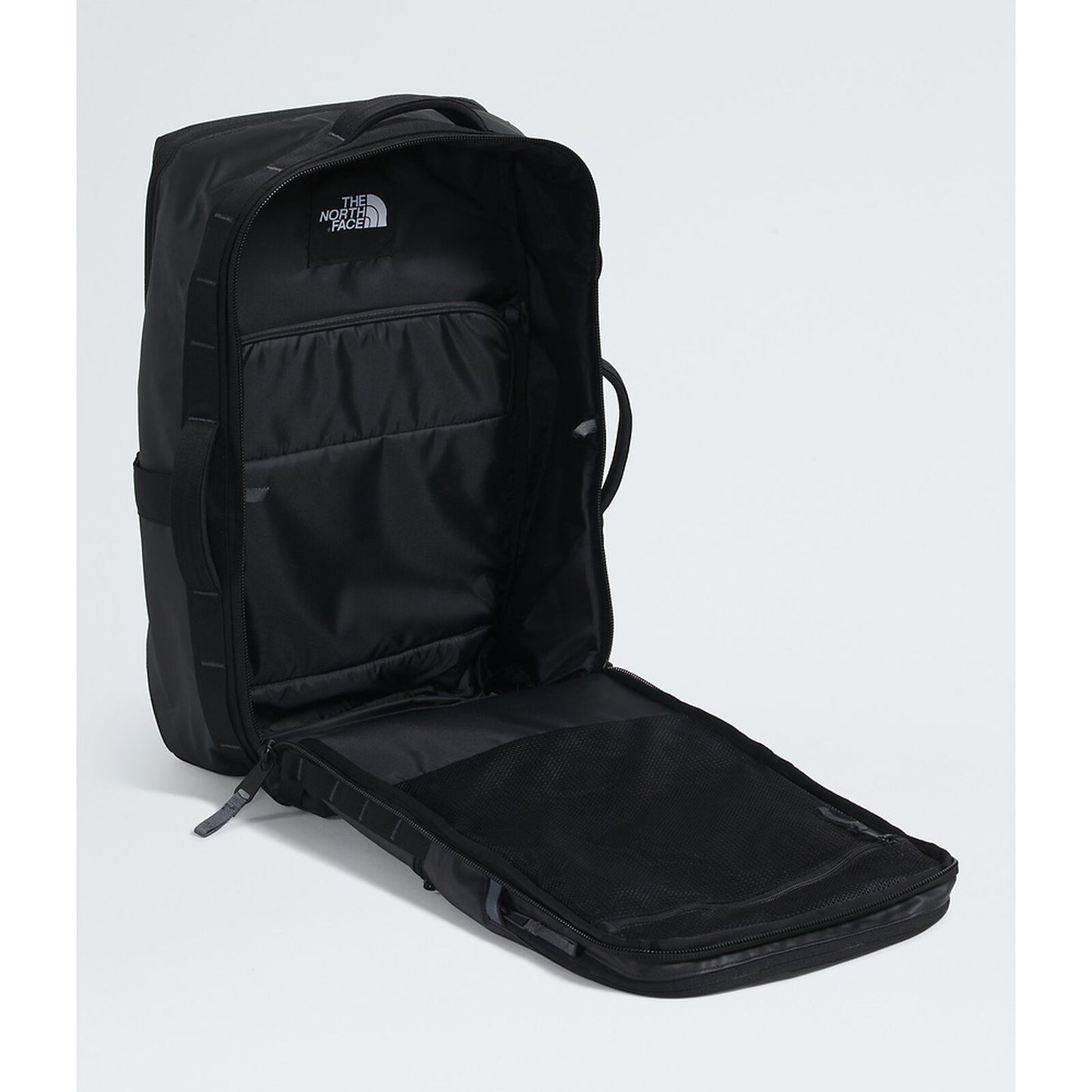 Black backpack with open front compartment on a white background