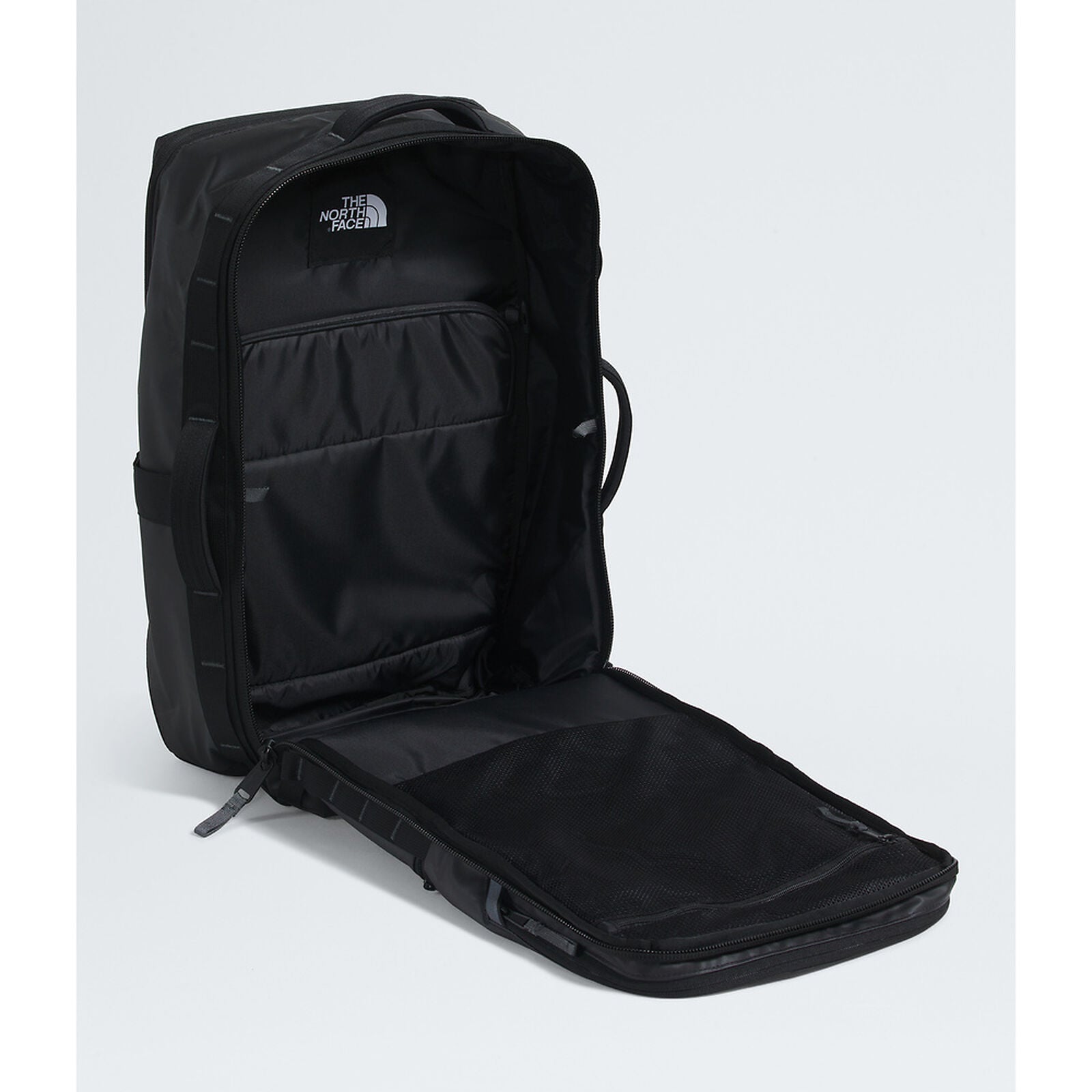 Black backpack with open front compartment on a white background