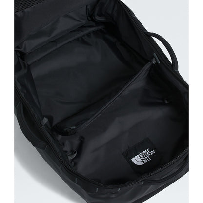 Black backpack with The North Face logo on a light gray background