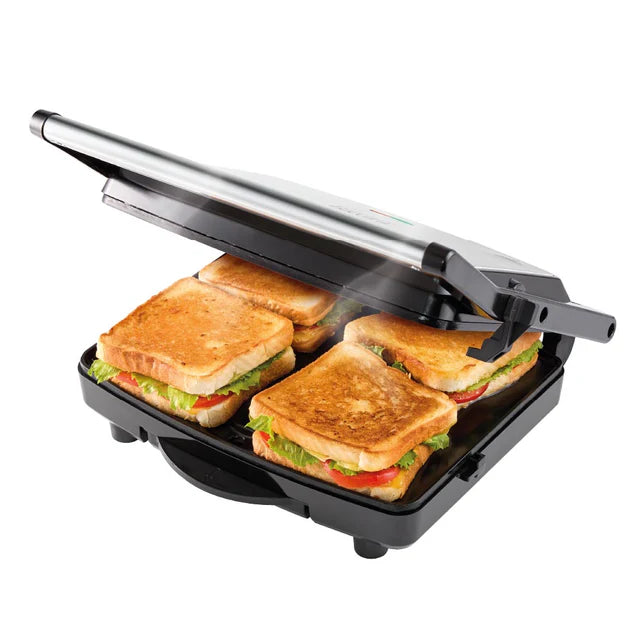 Sandwich maker with four grilled sandwiches on a white background
