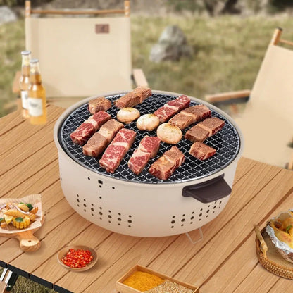 Portable grill with food on a wooden table outdoors