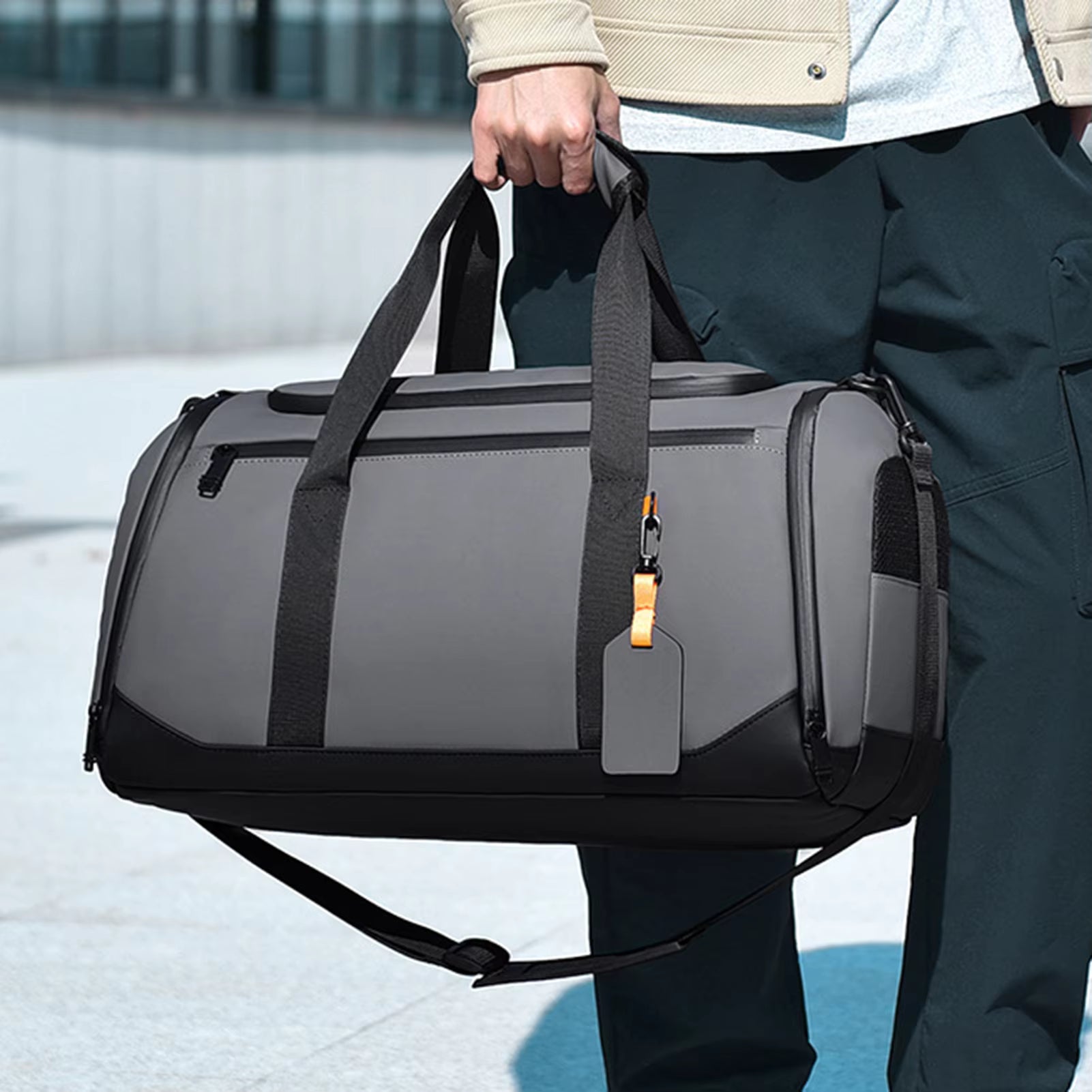 Travel duffel bag being carried - lifestyle shot