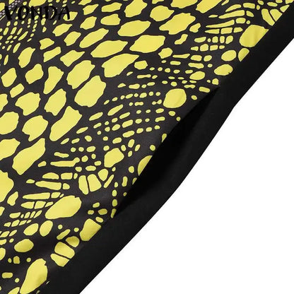Black fabric with yellow abstract pattern