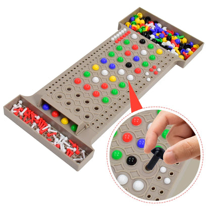 Board game with colorful pegs and a hand placing a black peg on a white peg.