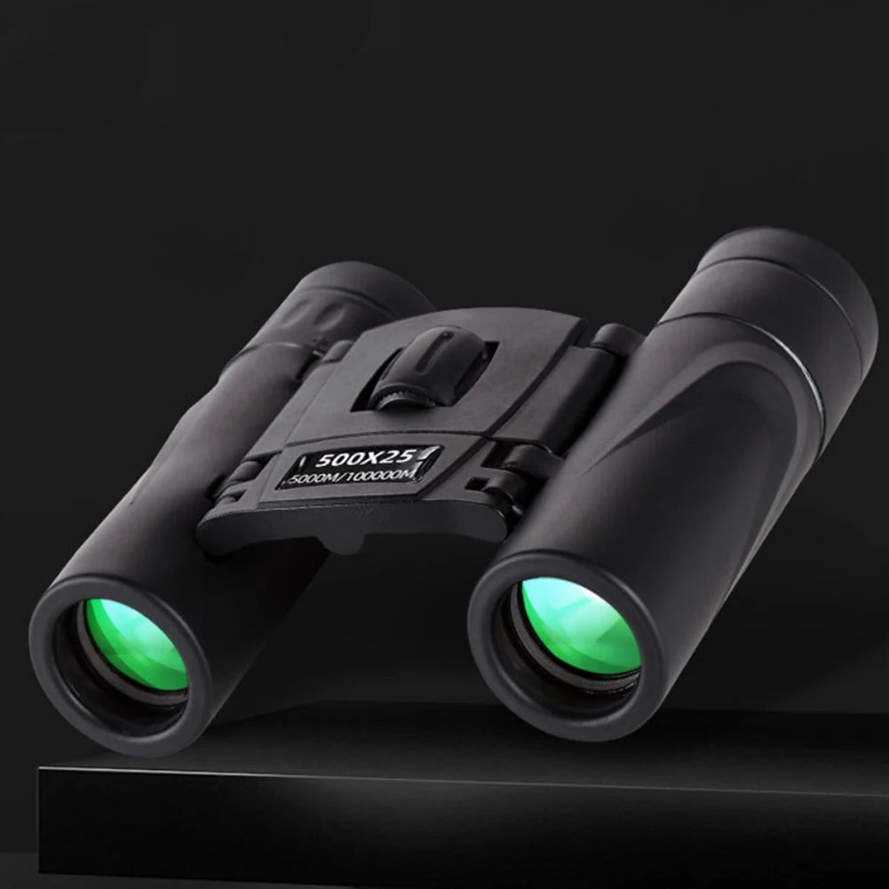 Black binoculars with green lenses on a black background