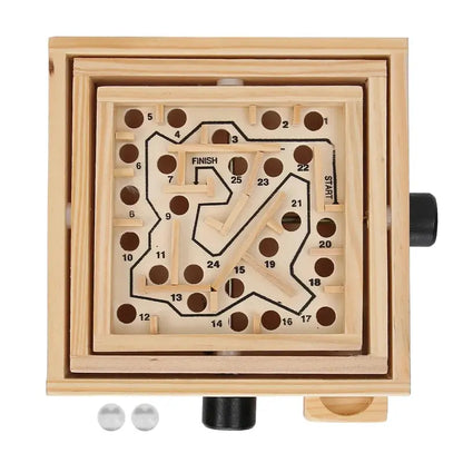 Wooden marble run puzzle with marble tracks on a white background