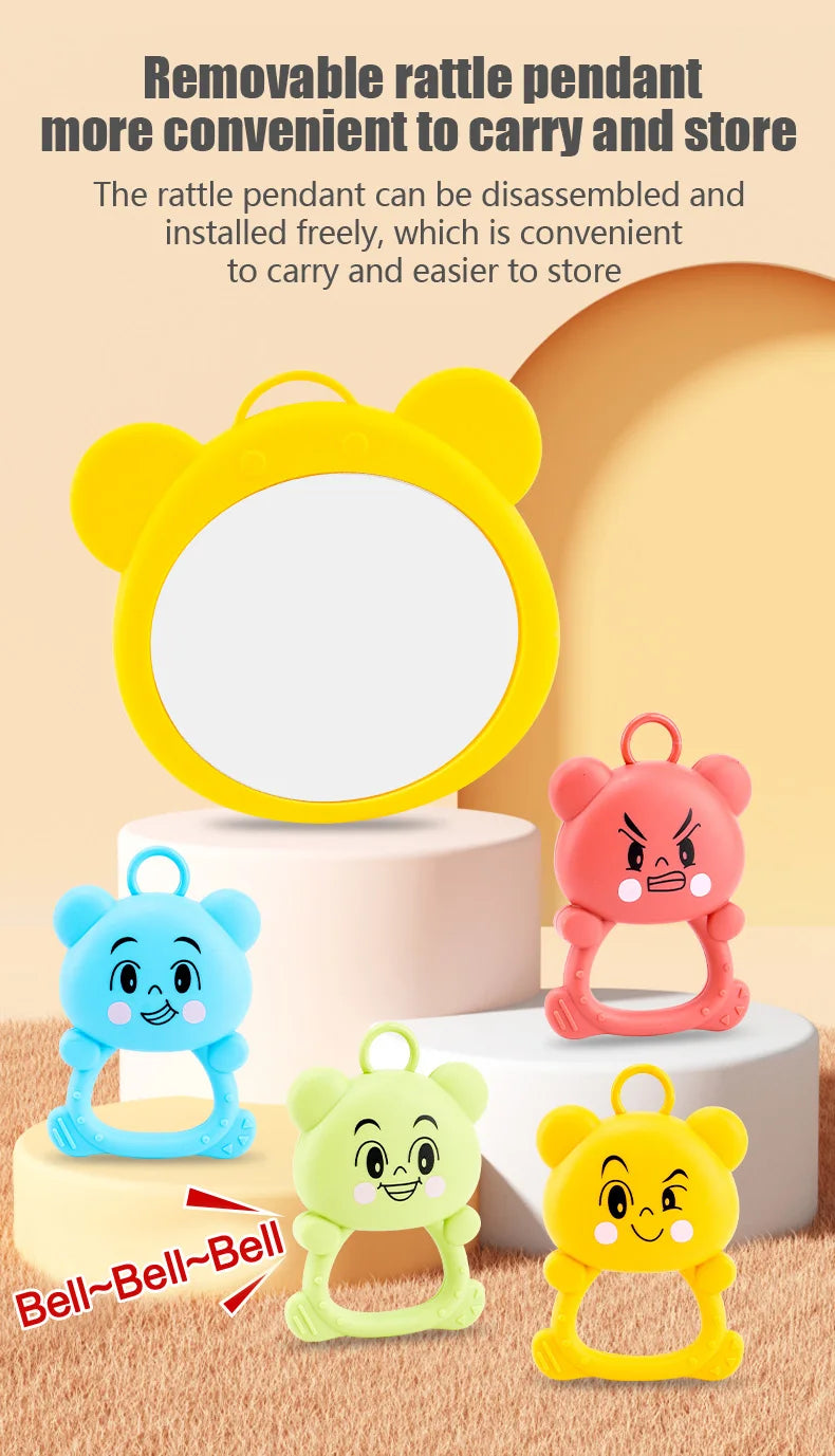 Colorful rattles with detachable pendants on a beige background