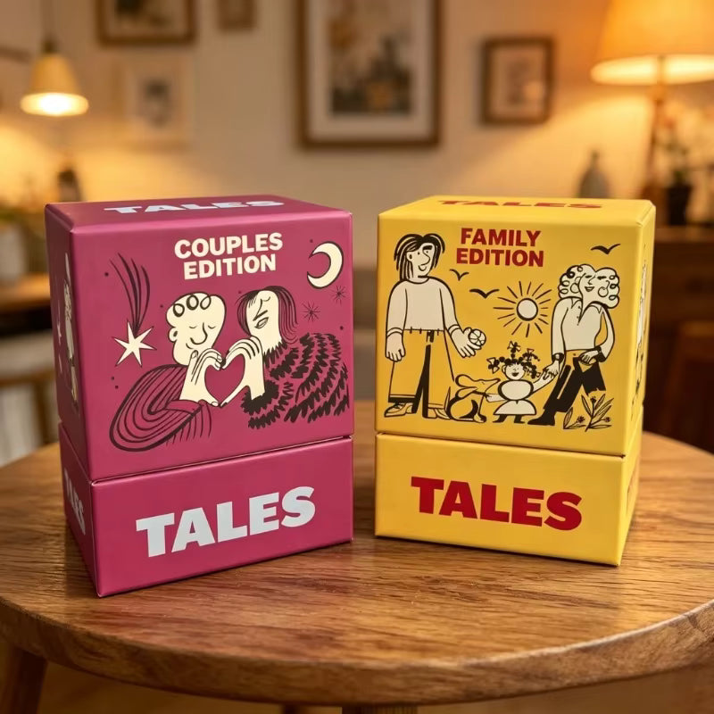 TALES Couples Edition and Family Edition boxes displayed on a wooden table in a living room setting