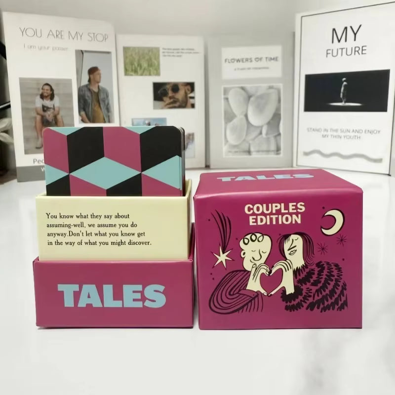 TALES Couples Edition box open with the card deck, styled with framed art in the background