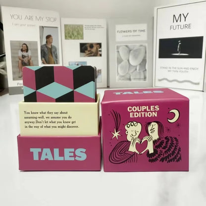 TALES Couples Edition box open with the card deck, styled with framed art in the background