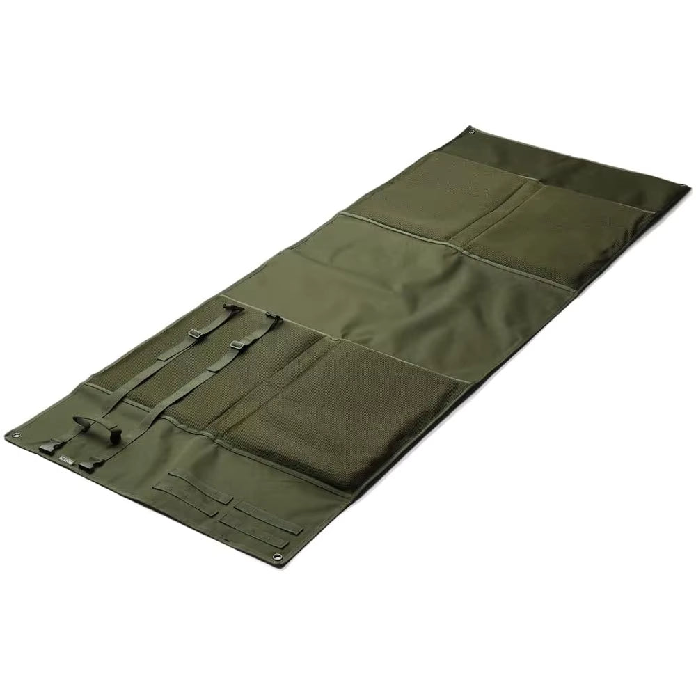 Tactical shooting mat unrolled flat showing built-in gear pouches and elastic retention loops, green