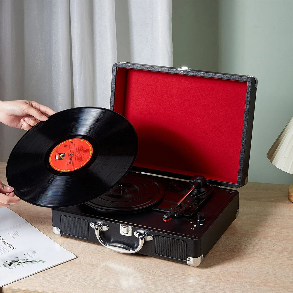 Retro suitcase turntable with 3-speed playback on a tabletop