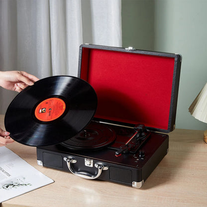 Retro suitcase turntable with 3-speed playback on a tabletop