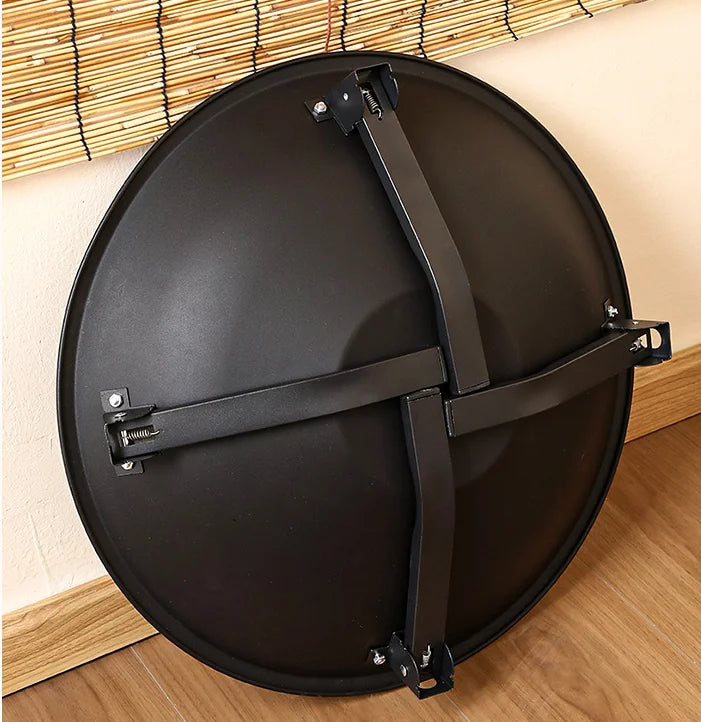 Black folding BBQ fire pit folded flat for storage