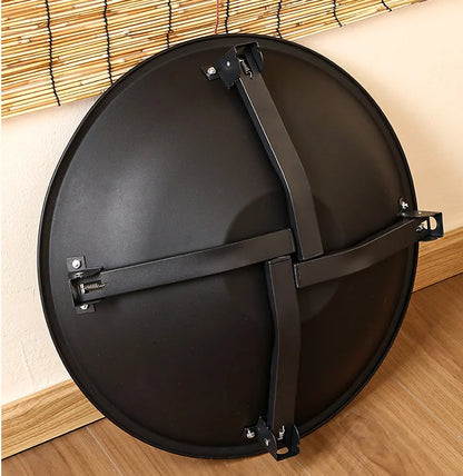 Black folding BBQ fire pit folded flat for storage