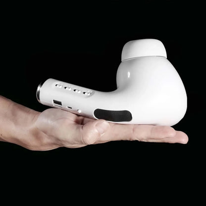 White handheld electronic device held in a hand against a black background