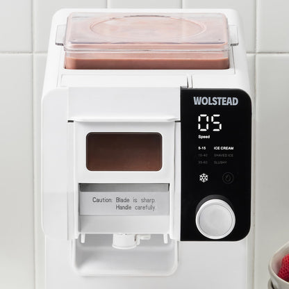 Wolstead Carnival Shaved Ice Maker on a benchtop with shaved ice dessert