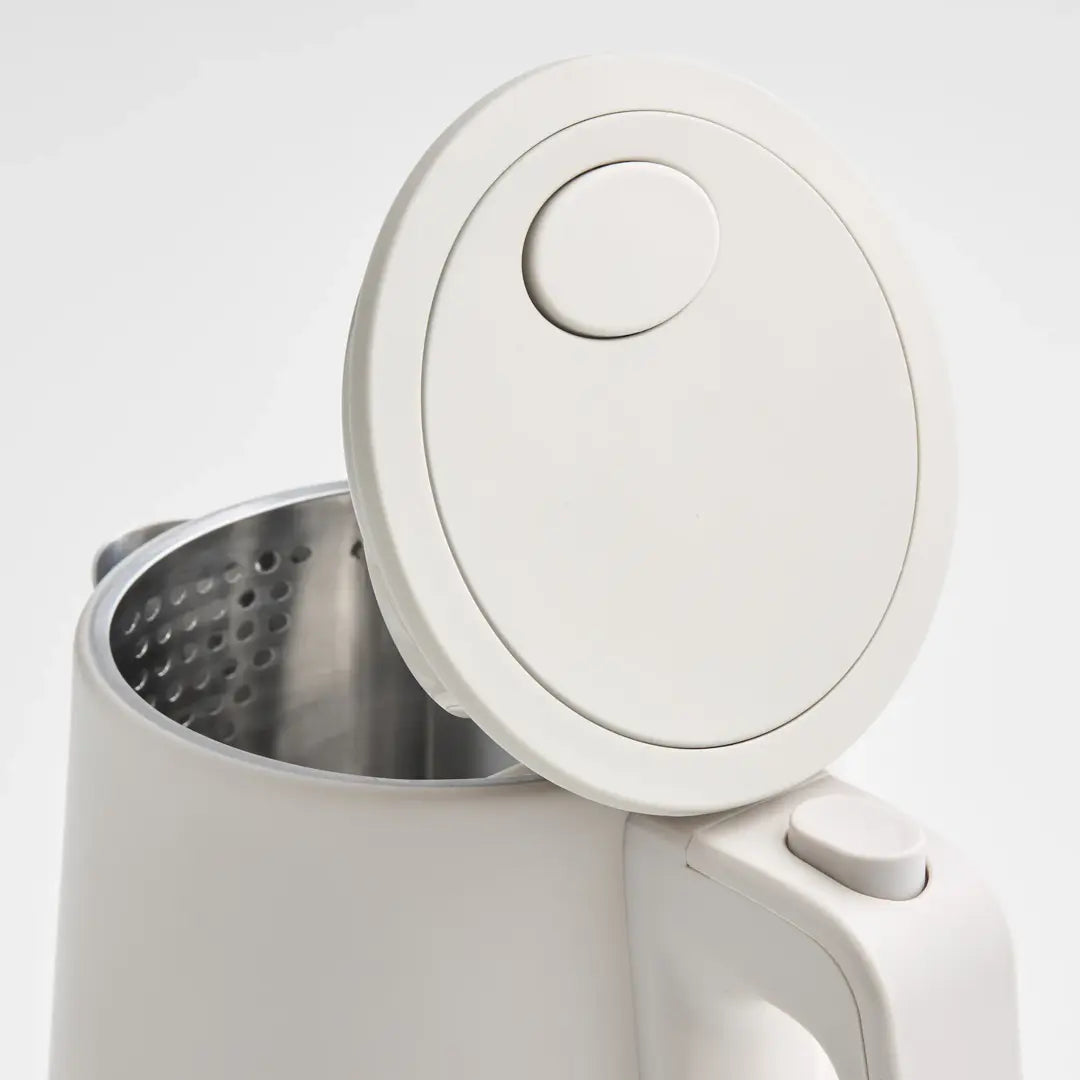 White electric kettle with a open lid on a white background
