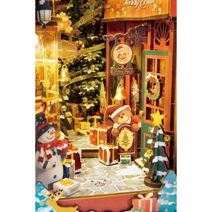 Christmas-themed diorama with teddy bears, snowmen, and decorative trees.