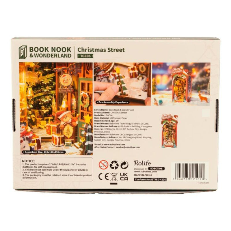 Box of 'Book Nook & Wonderland Christmas Street' toy set with images and text on a white background