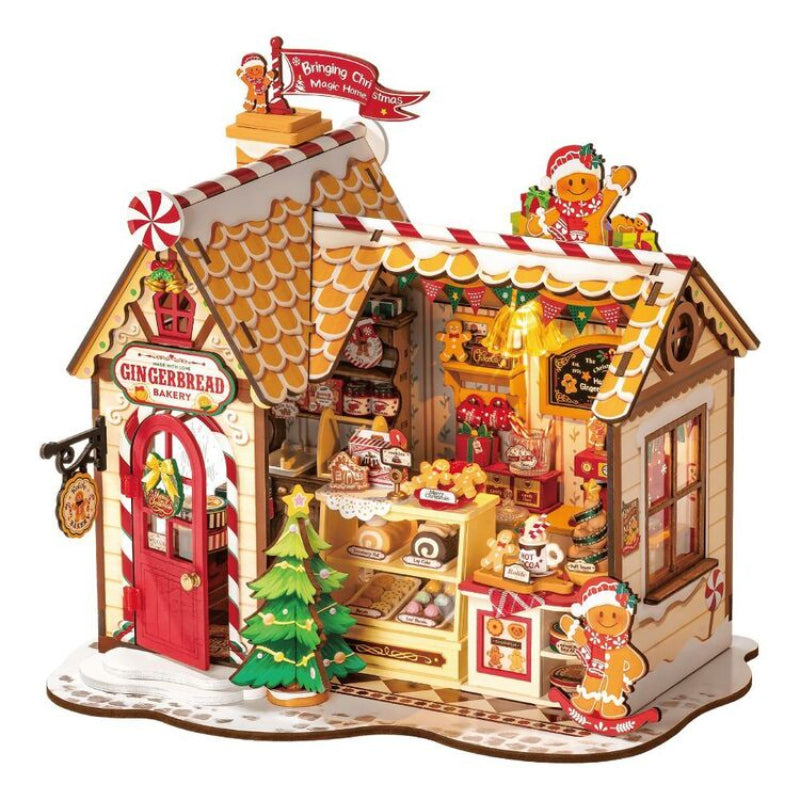 Gingerbread bakery toy set with gingerbread men and decorations on a white background