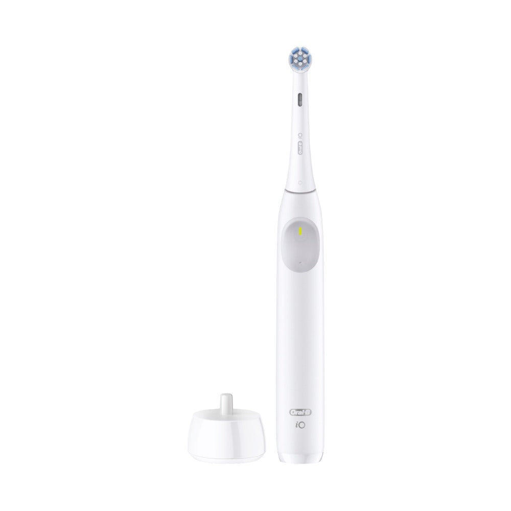 Oral-B iO Series 2 white electric toothbrush with charging base on white background
