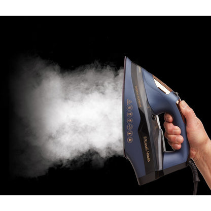 Hand holding a steam iron emitting steam against a black background