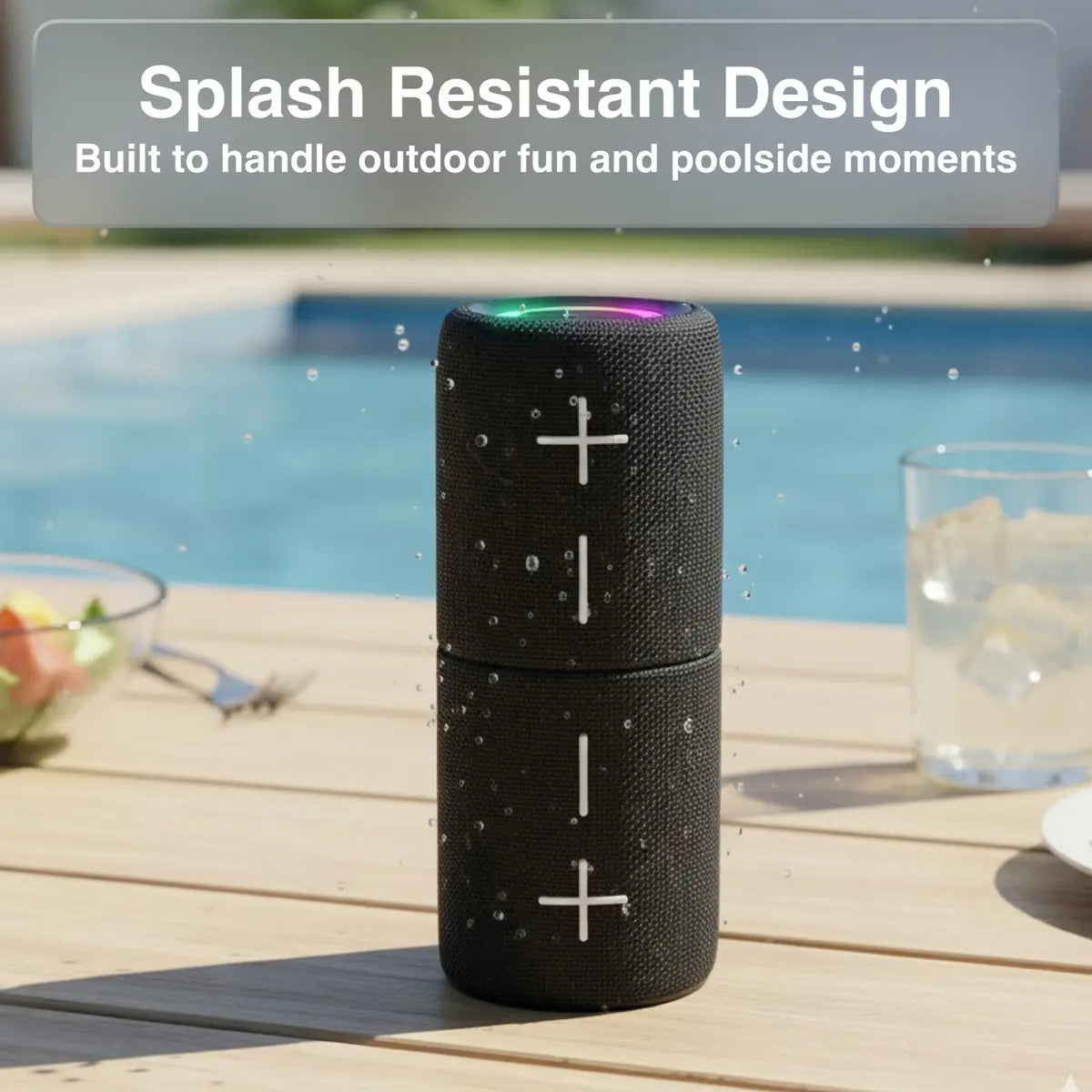 Black Bluetooth speaker with splash resistant design by a poolside