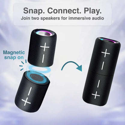 Black cylindrical Bluetooth speaker with a reflective surface on a white background