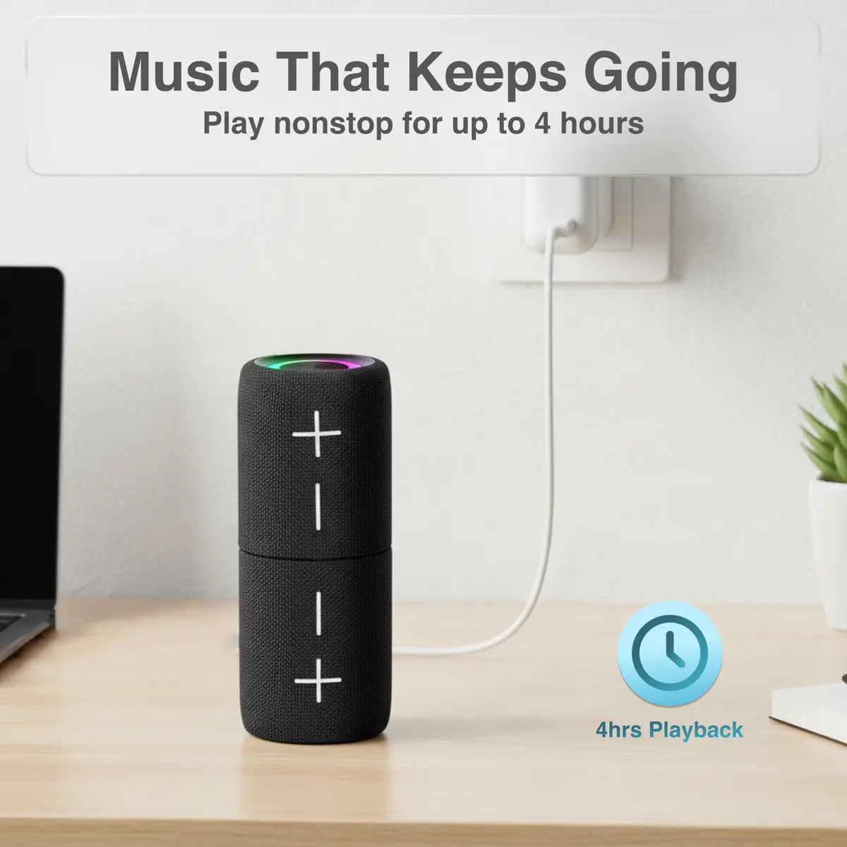 Black portable speaker on a desk with text about music playback time