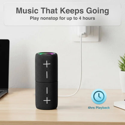 Black portable speaker on a desk with text about music playback time