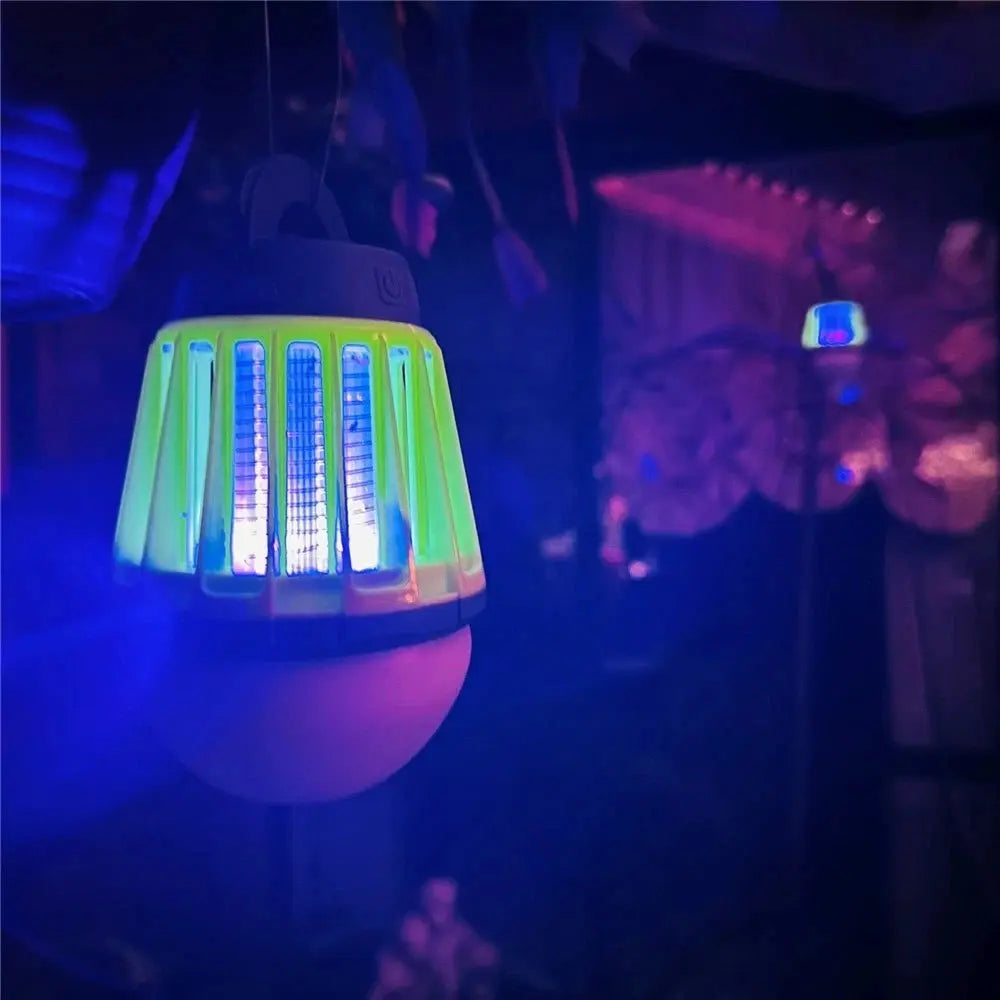 Insect repellent lamp emitting a blue light in a dark setting