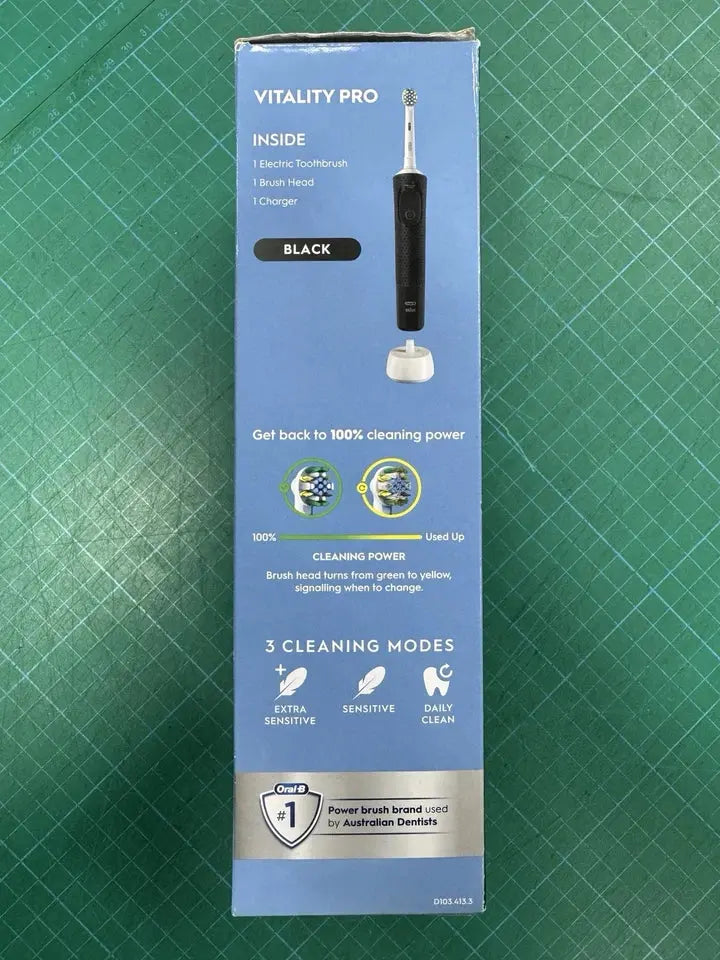 Vitality Pro dental cleaning device packaging on a green grid background